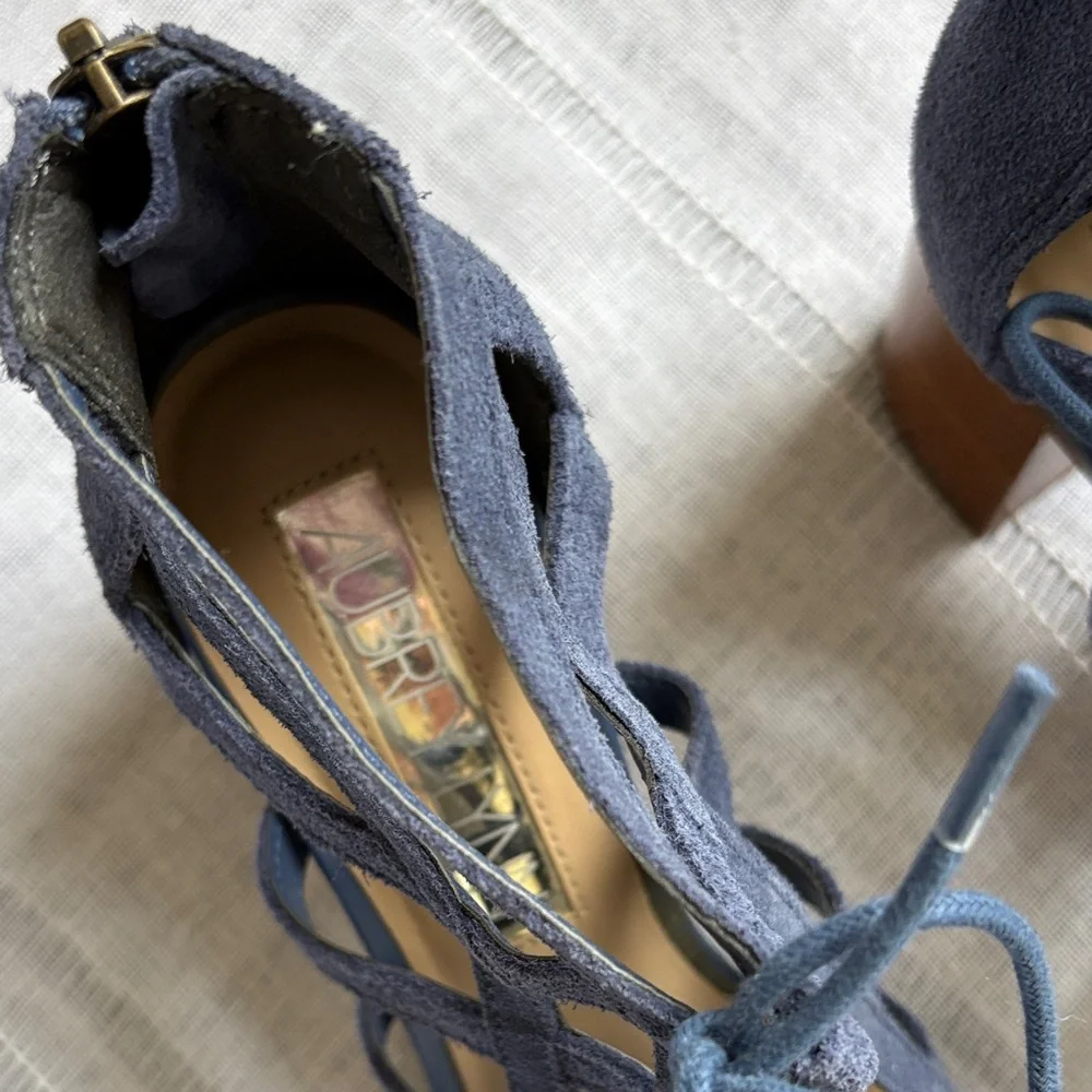 Aubrey Lynn blue suede gladiator-style heels with a tie and zip closure